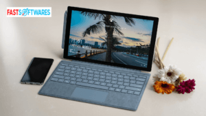 laptop on a desk with smart phone