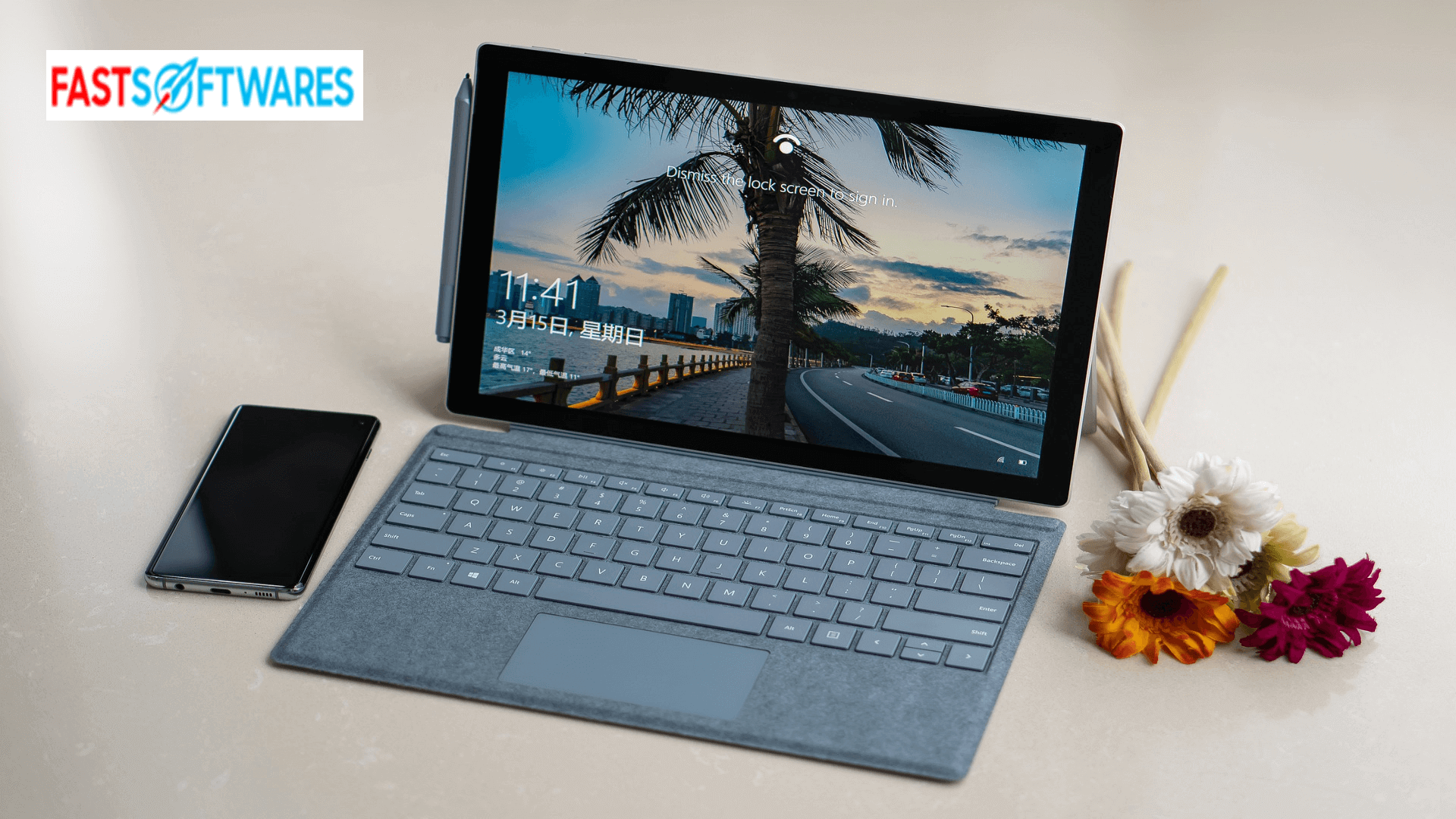 laptop on a desk with smart phone